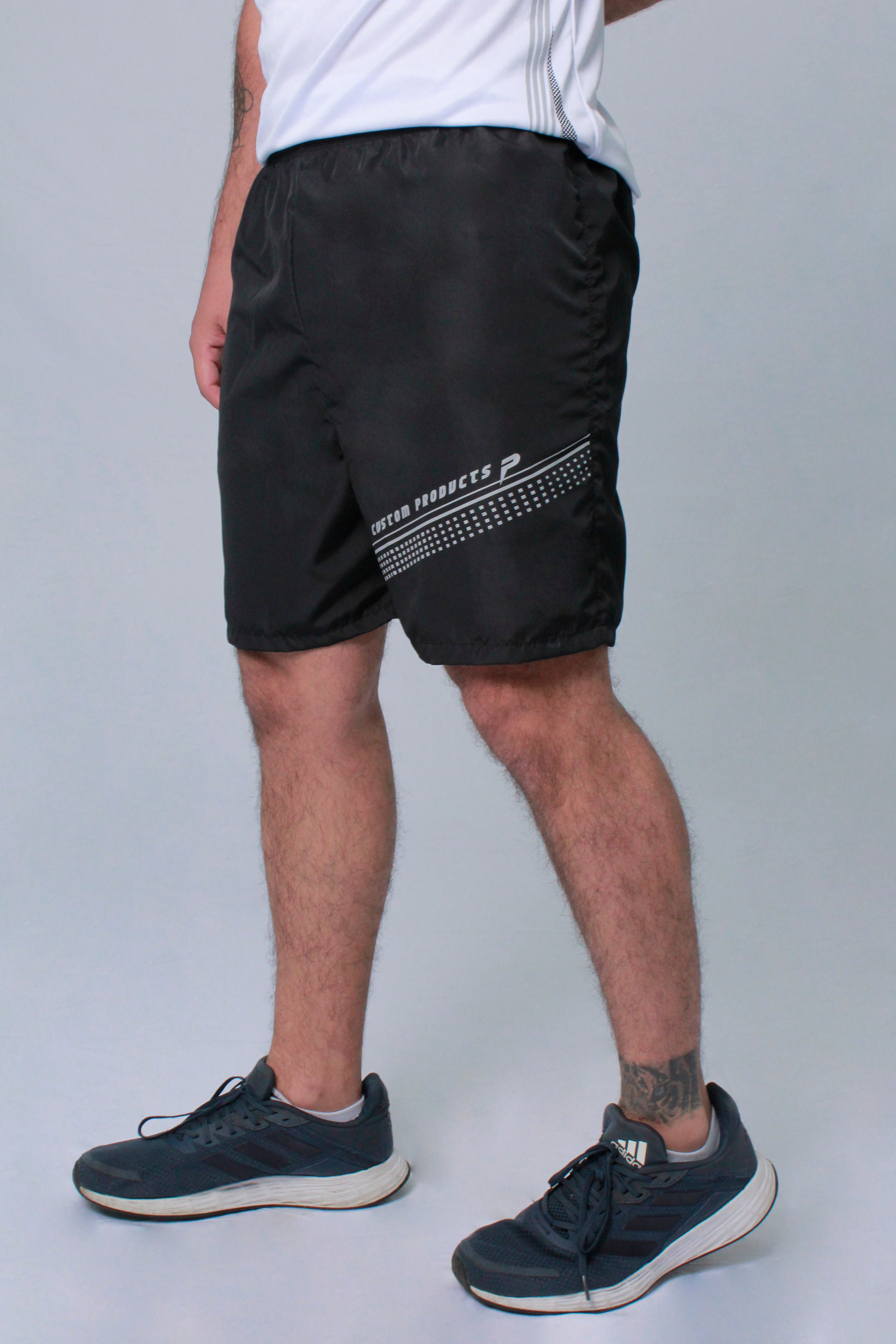 Pantaloneta deportiva hombre estampado delantero