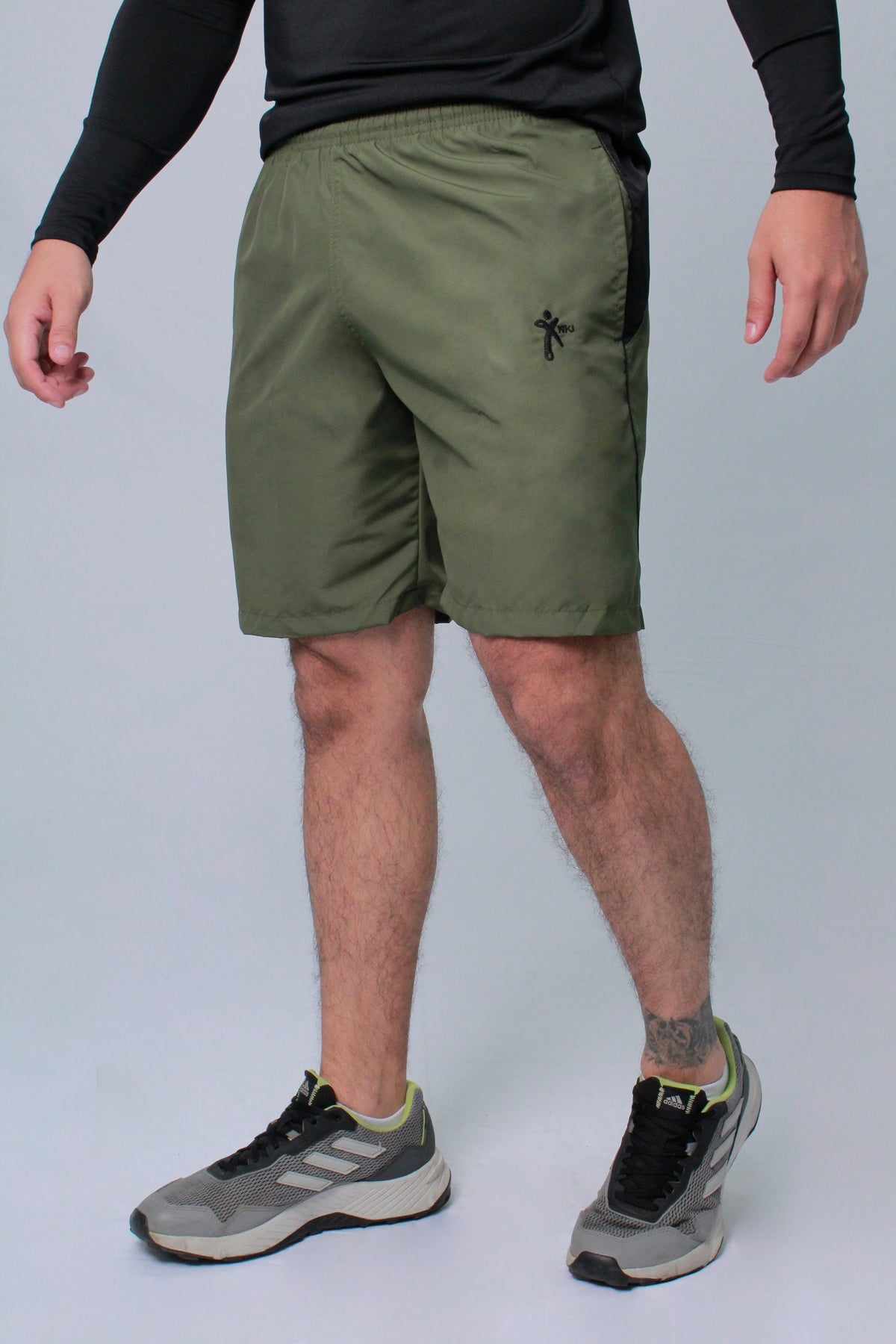 Pantaloneta Deportiva NKI hombre con bolsillo lateral